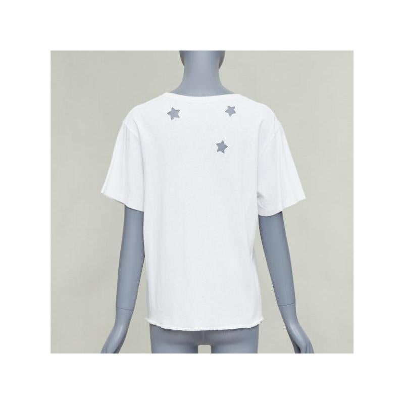 SAINT LAURENT off white cotton star embroidered cut out relaxed tshirt en vente 1
