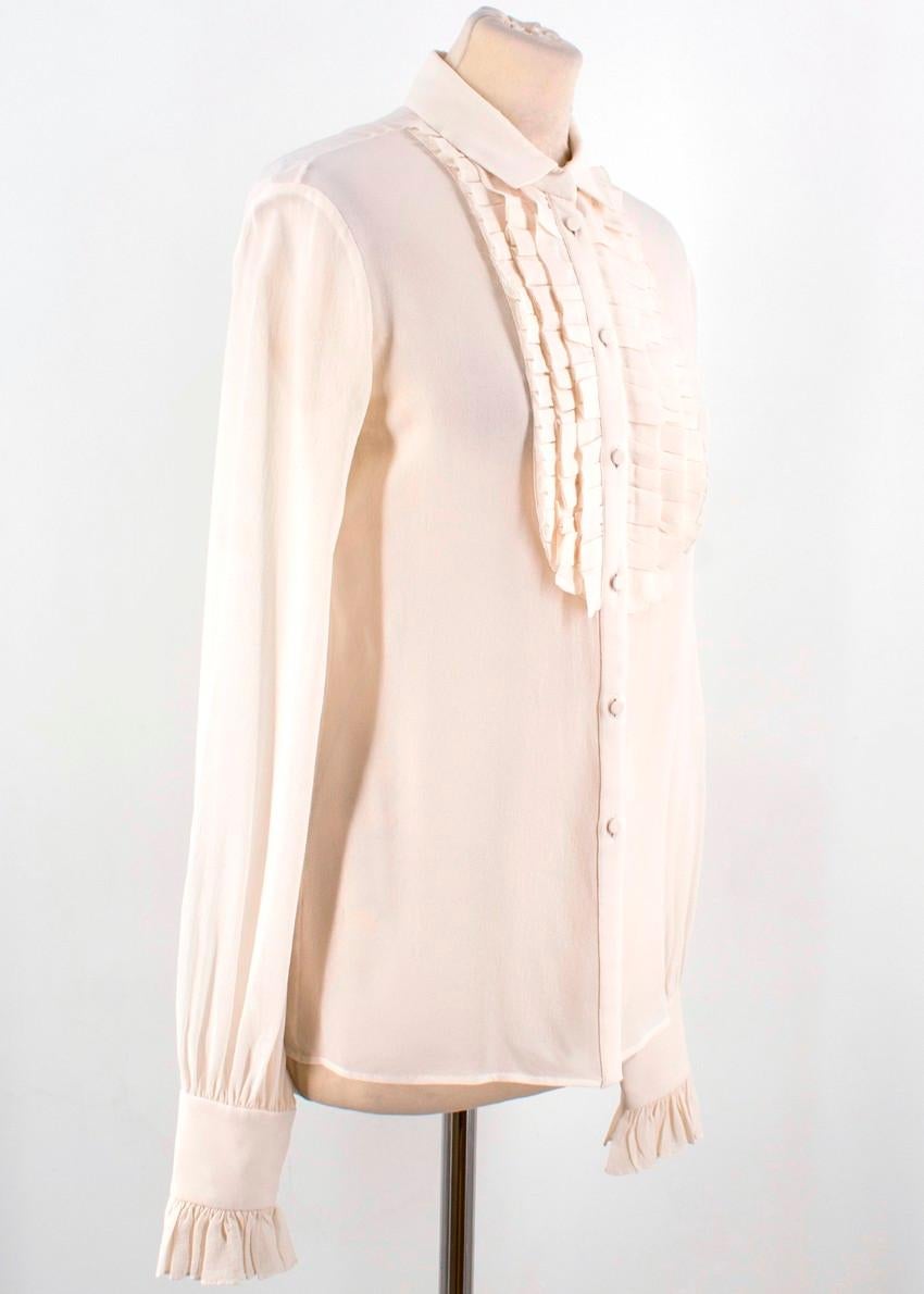 Saint Laurent Off-white Silk Ruffle Blouse

- 100% pure silk
- Off-white/cream
- Semi sheer
- Collared 
- Button-front fastening
- Long sleeves with buttoned and ruffled cuffs
- Ruffled bib detail

Please note, these items are pre-owned and may show