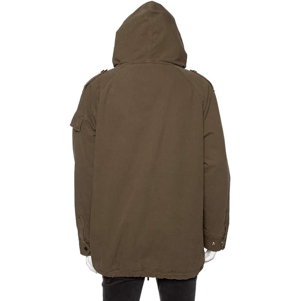 Saint Laurent brings to you this comfy, uber-chic parka jacket that oozes style. It features an olive green color, has a hoodie as well as external pockets. Created from cotton, the long-sleeved piece is exactly what you need for those busy, rainy