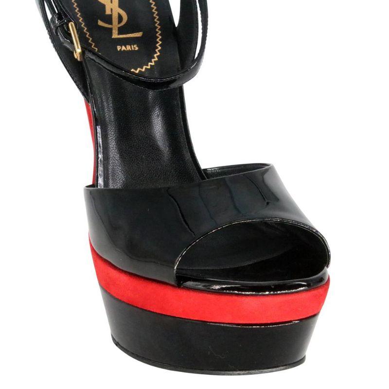 Saint Laurent Open Toe 40 Patent Leather Pumps SL-0910N-0004

Here is another creation by Saint Laurent signature black high heels with bright red patent leather details featuring open toe, front strap with bright red button and stiletto mid heel,