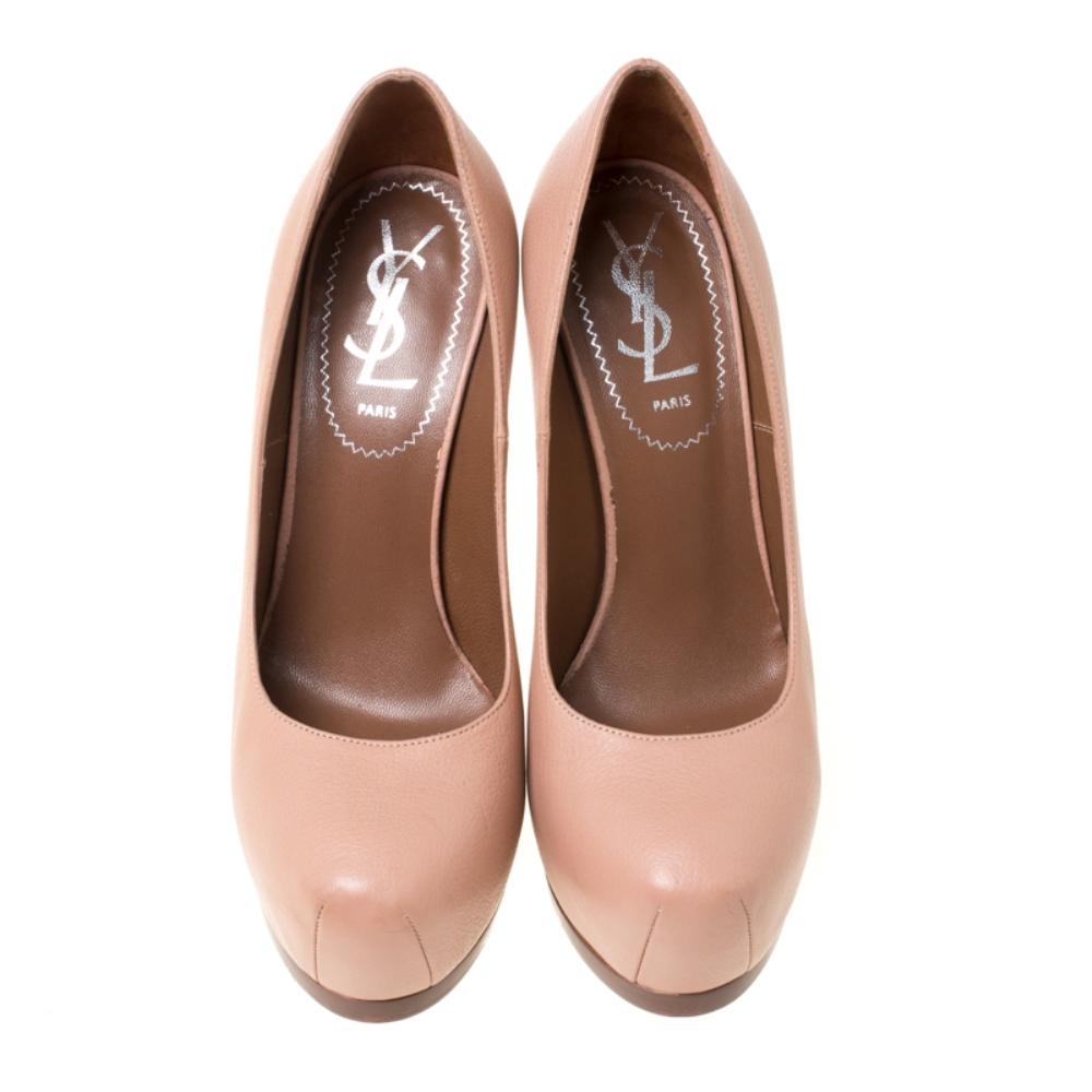 Fashionable and chic, these Tribtoo pumps from Saint Laurent Paris will cut an alluring silhouette from day to night. Crafted from durable leather, the pumps have a soft beige shade, concealed platforms, and 13.5 cm heels.

Includes: The Luxury