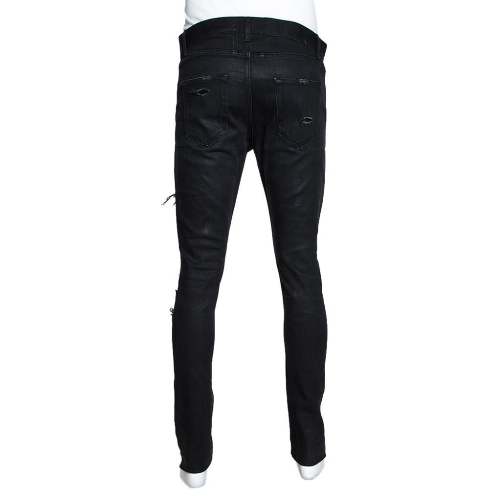 For days of ease and casual style, this pair of Saint Laurent jeans will be just right. Made from a cotton blend, the black jeans feature distressed details, belt loops, pockets and front closure. The pair will offer you a skinny fit.

