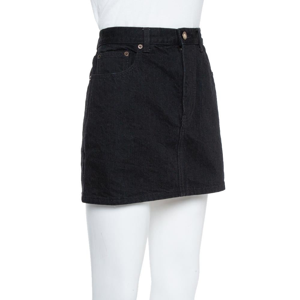 This mini skirt from Saint Laurent is well-tailored and comfortable. The denim skirt comes with button-zip closure and multiple pockets. It is simple and lovely. You may wear it with a white T-shirt and sneakers or high heels.

