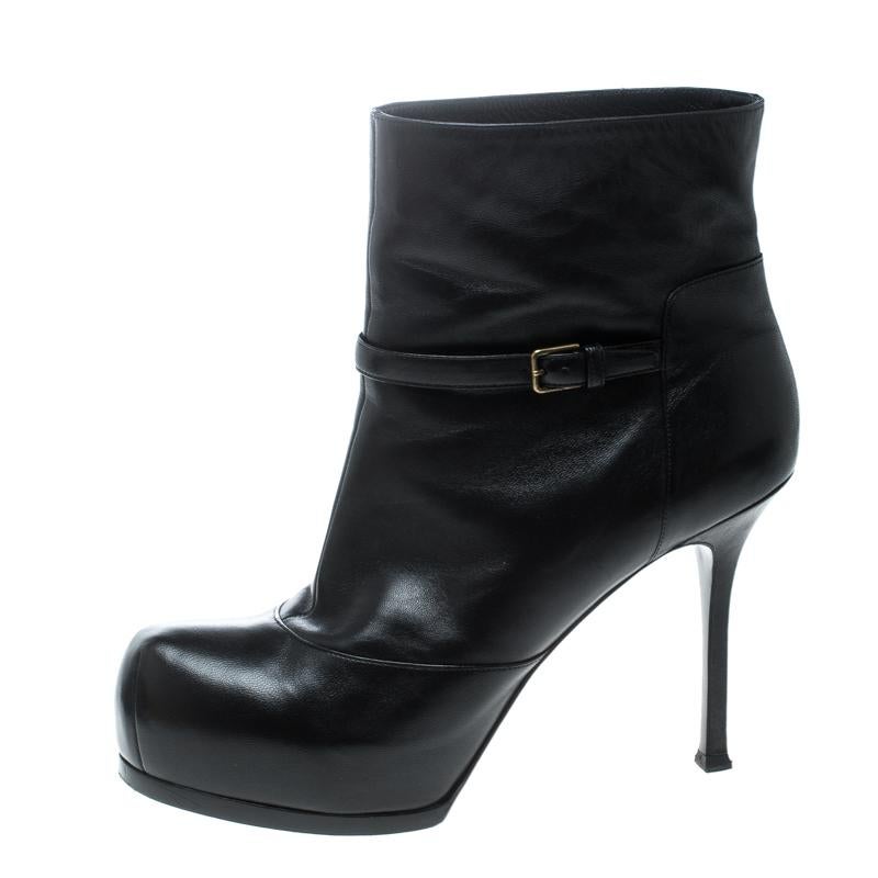 Durable and chic, these ankle boots from Saint Laurent Paris will cut an alluring silhouette from day to night. Crafted from leather, the ankle boots have belt details, concealed platforms, and 11 cm heels. They are complete with comfortable insoles