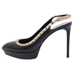 Saint Laurent Paris Schwarze Leder-Pumps mit Nieten und spitzer Zehe und Slingback Plateau-Pumps S