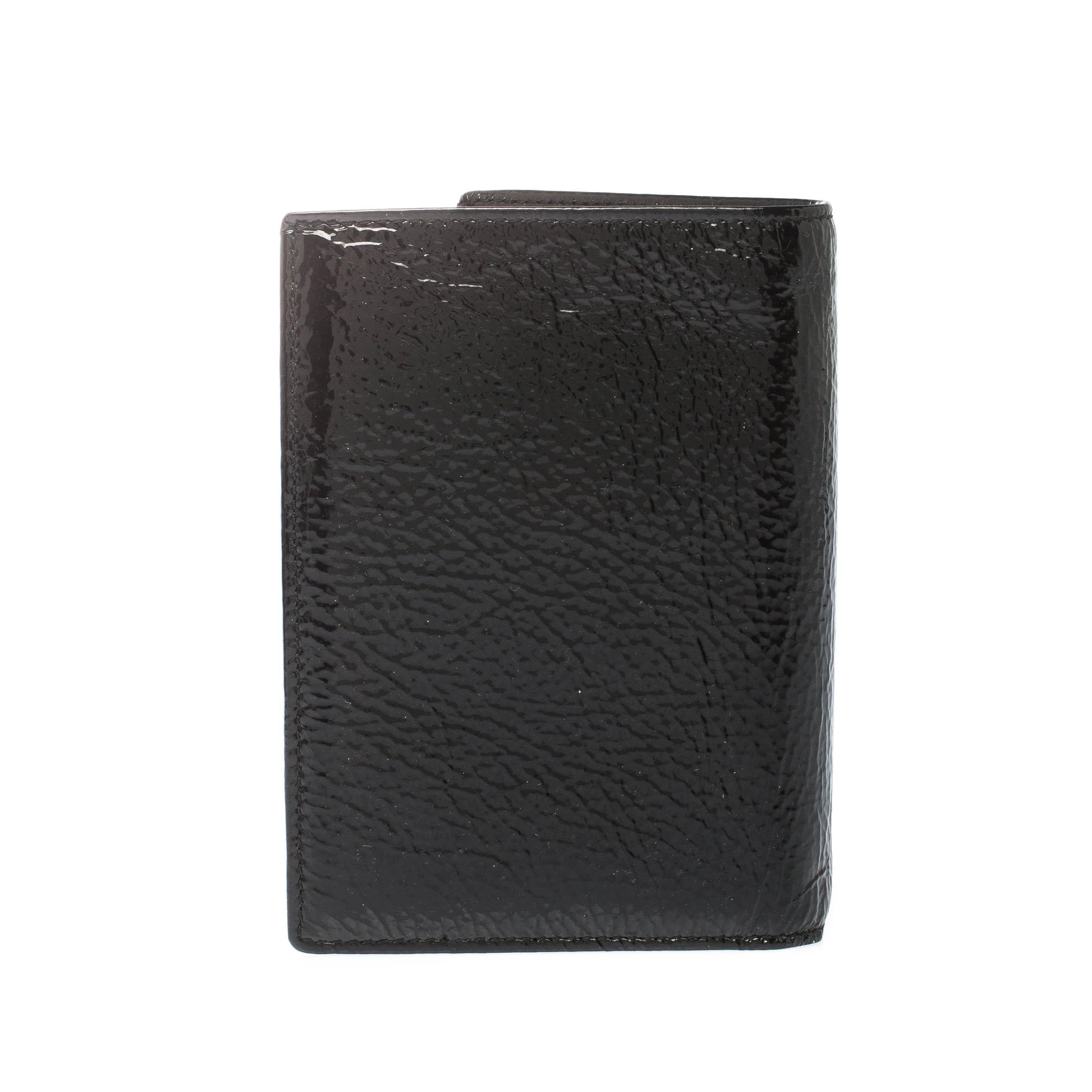 Wallets like this one from Saint Laurent are not only functional but also stylish. Crafted from patent leather this wallet comes as a bi-fold. It has the iconic YSL on the front and is equipped with multiple slots and enough space to neatly arrange