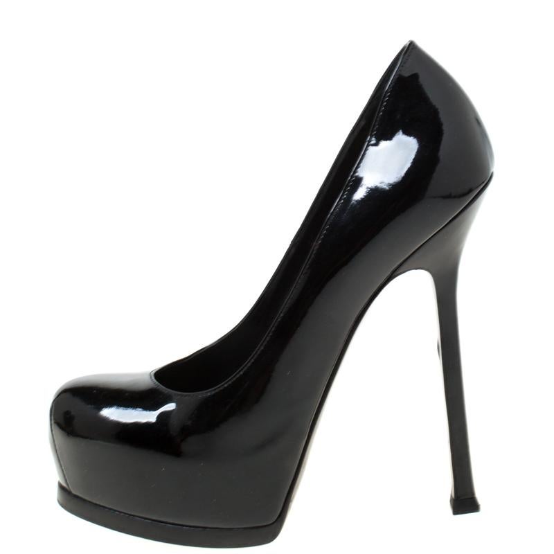 Fashionable and chic, these Tribtoo pumps from Saint Laurent Paris will cut an alluring silhouette from day to night. Crafted from patent leather, the pumps have a black shade, concealed platforms, and 14 cm heels.

Includes: The Luxury Closet