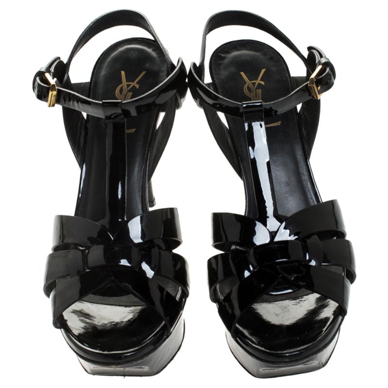 One of the most sought-after designs from Saint Laurent is their Tribute sandals. They are such a craze amongst fashionistas around the world, and it is time you own one yourself. These black ones are designed with patent leather straps, ankle