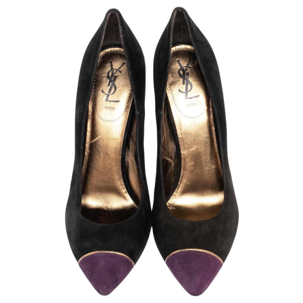 A feminine flair, sleek cuts, and a timeless appeal characterize these stunning Saint Laurent Paris pumps. Crafted from suede in a black shade, they have purple pointed cap toes and are raised on slender heels.

