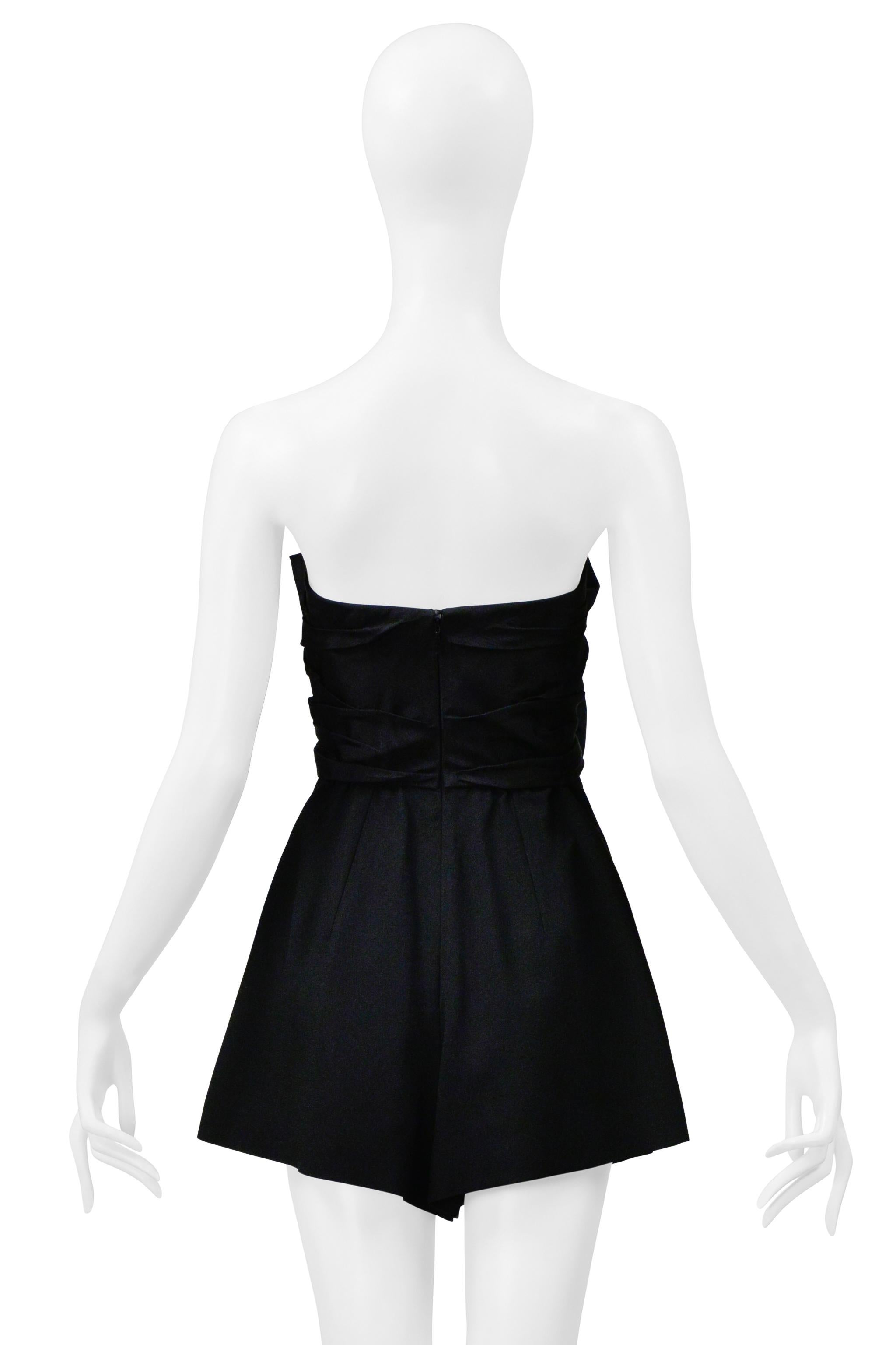 Resurrection is excited to offer a Saint Laurent Paris by Anthony Vaccarello black romper with bows and a cut-out chest featuring a strapless fit, pleated shorts, and a hidden back zipper closure. 

Saint Laurent Paris
Size: F36
Fabric: Fabric 1: