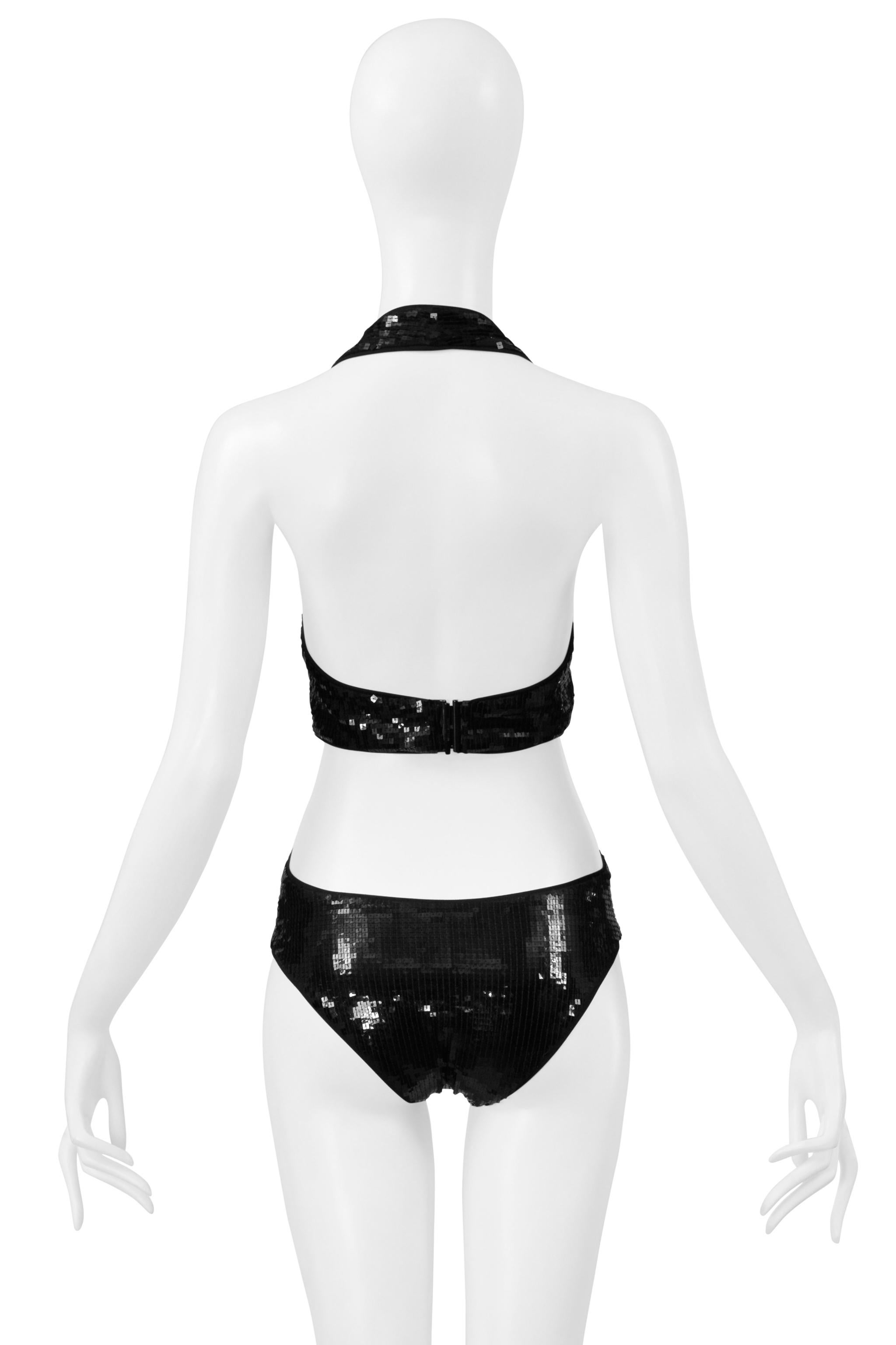 Resurrection Vintage is thrilled to present a Saint Laurent Paris by Anthony Vaccarello black square sequin body suit with cutouts, stretch fabric, and center back closure.  

Saint Laurent Paris 

By Anthony Vaccarello
Size: No Size Label. Fits