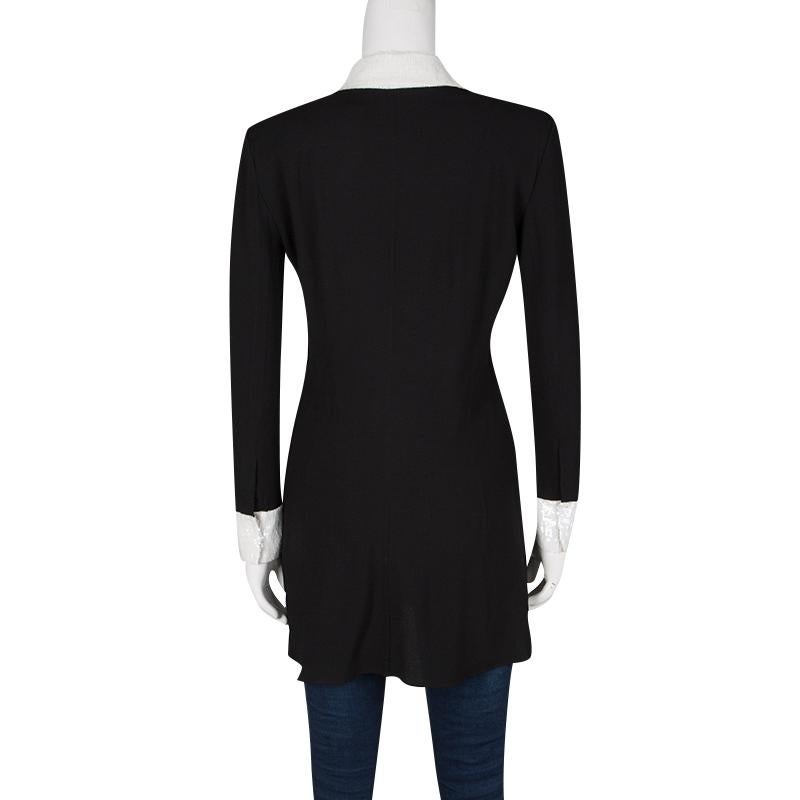 Saint Laurent Paris's dress is so chic and glamorous yet so effortless. It features a black body with full sleeves. It comes with sequin detailing along the yoke and cuffs making it a stand-out piece. This short dress required minimal accessorizing.