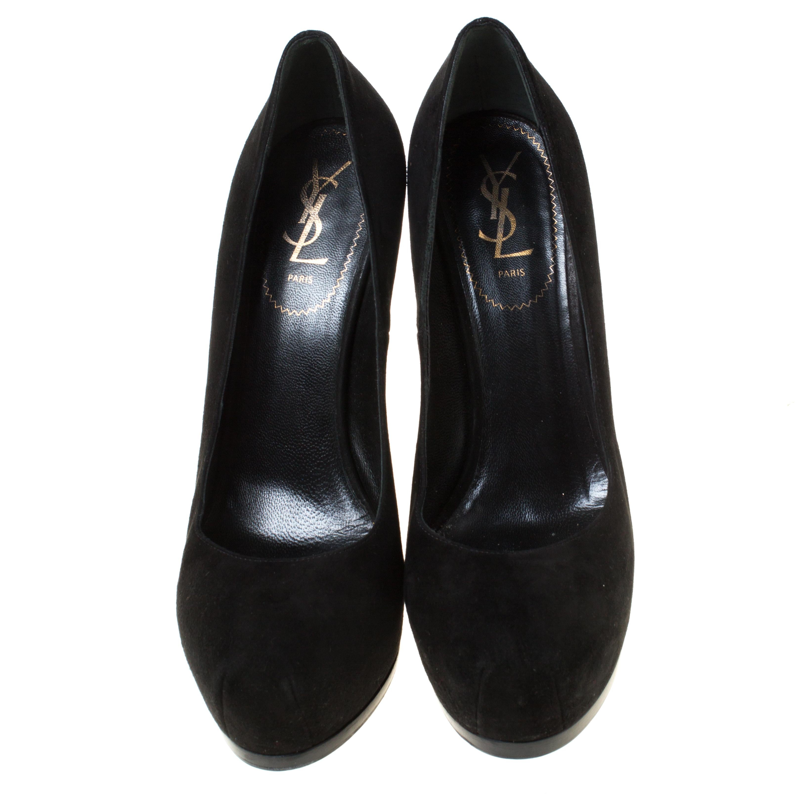 Fashionable and chic, these Tribtoo pumps from Saint Laurent will cut an alluring silhouette from day to night. Crafted from suede, the pumps have a black shade, concealed platforms, and 15.5 cm heels.

Includes: The Luxury Closet Packaging

