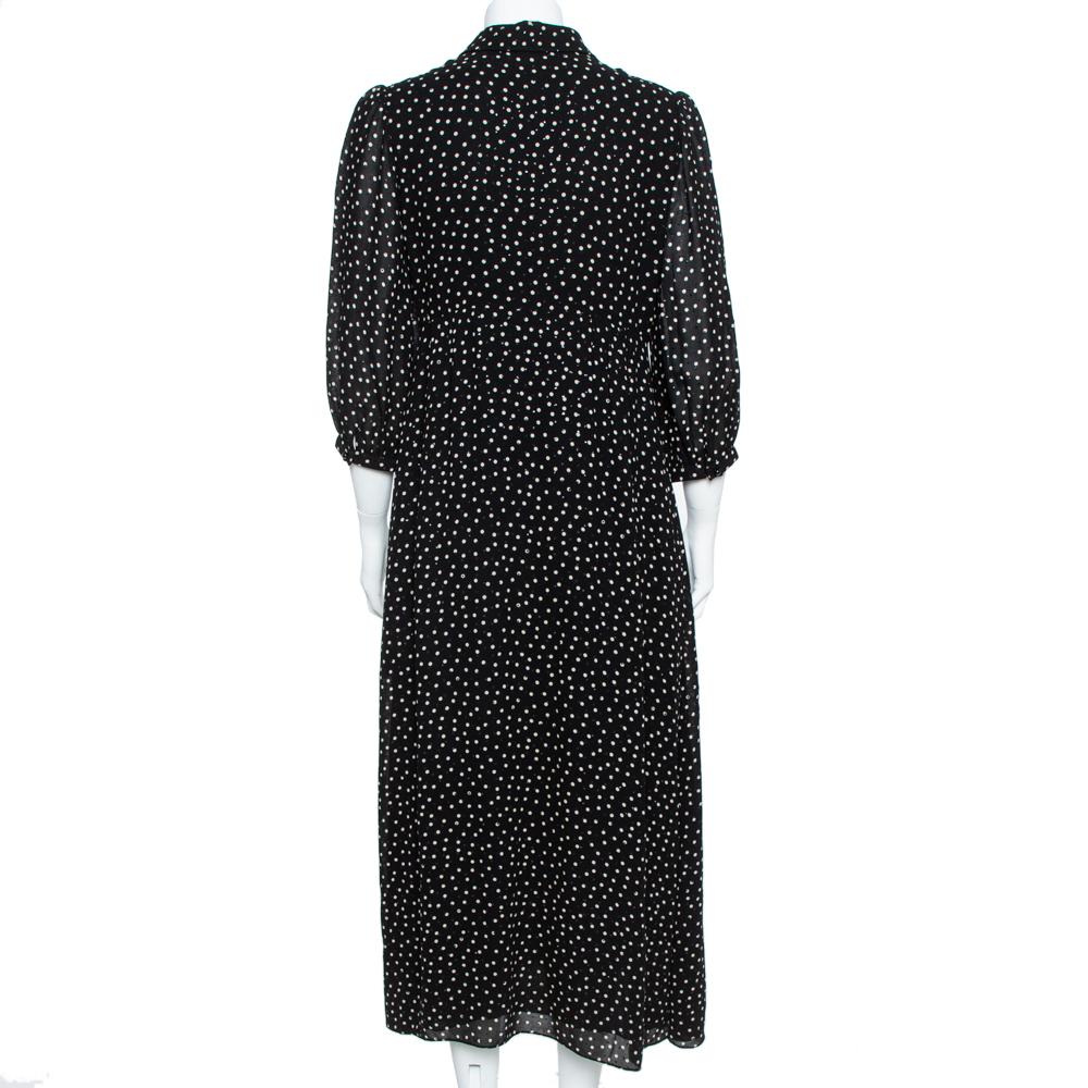 This splendid dress from Saint Laurent Paris will help you outline a distinctive look. The black silk creation is adorned with a white dotted print all over and styled with a lavalliere neckline and three-quarter sleeves. It will look amazing with