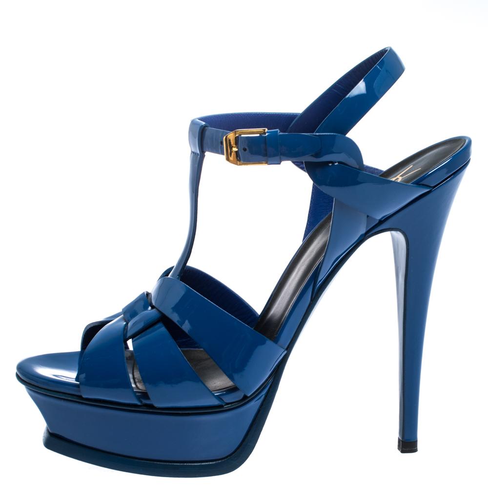 One of the most sought-after designs from Saint Laurent Paris is their Tribute sandals. They are such a craze amongst fashionistas around the world, and it is time you own one yourself. These blue ones are designed with patent leather straps, ankle