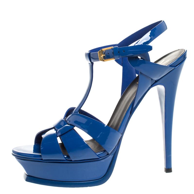 One of the most sought-after designs from Saint Laurent is their Tribute sandals. They are such a craze amongst fashionistas around the world, and it is time you own one yourself. These blue ones are designed with patent leather straps, ankle