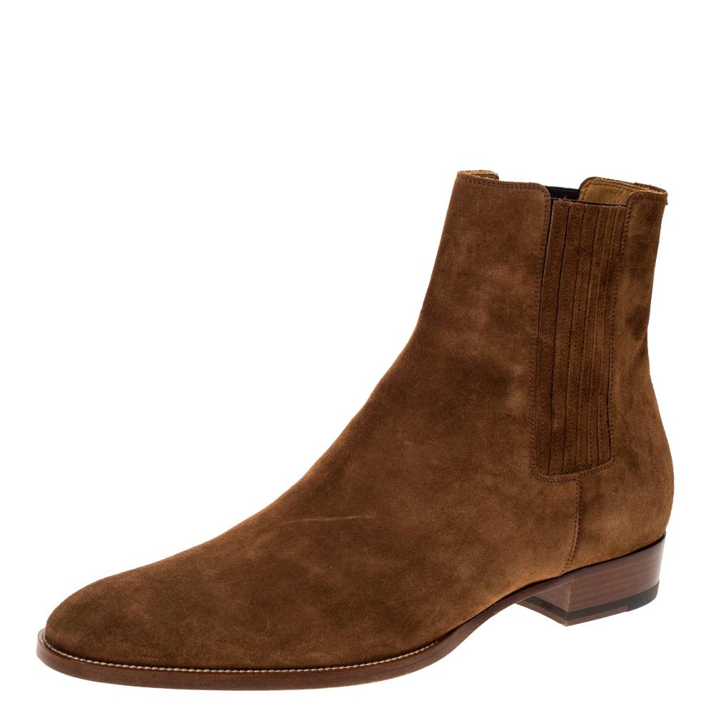 Celebrating the fusion of fine craftsmanship and luxury fashion, these Saint Laurent Paris Chelsea boots are absolutely worth the splurge. They are laceless and so well-crafted with suede. The boots are detailed with pleated panels and equipped with