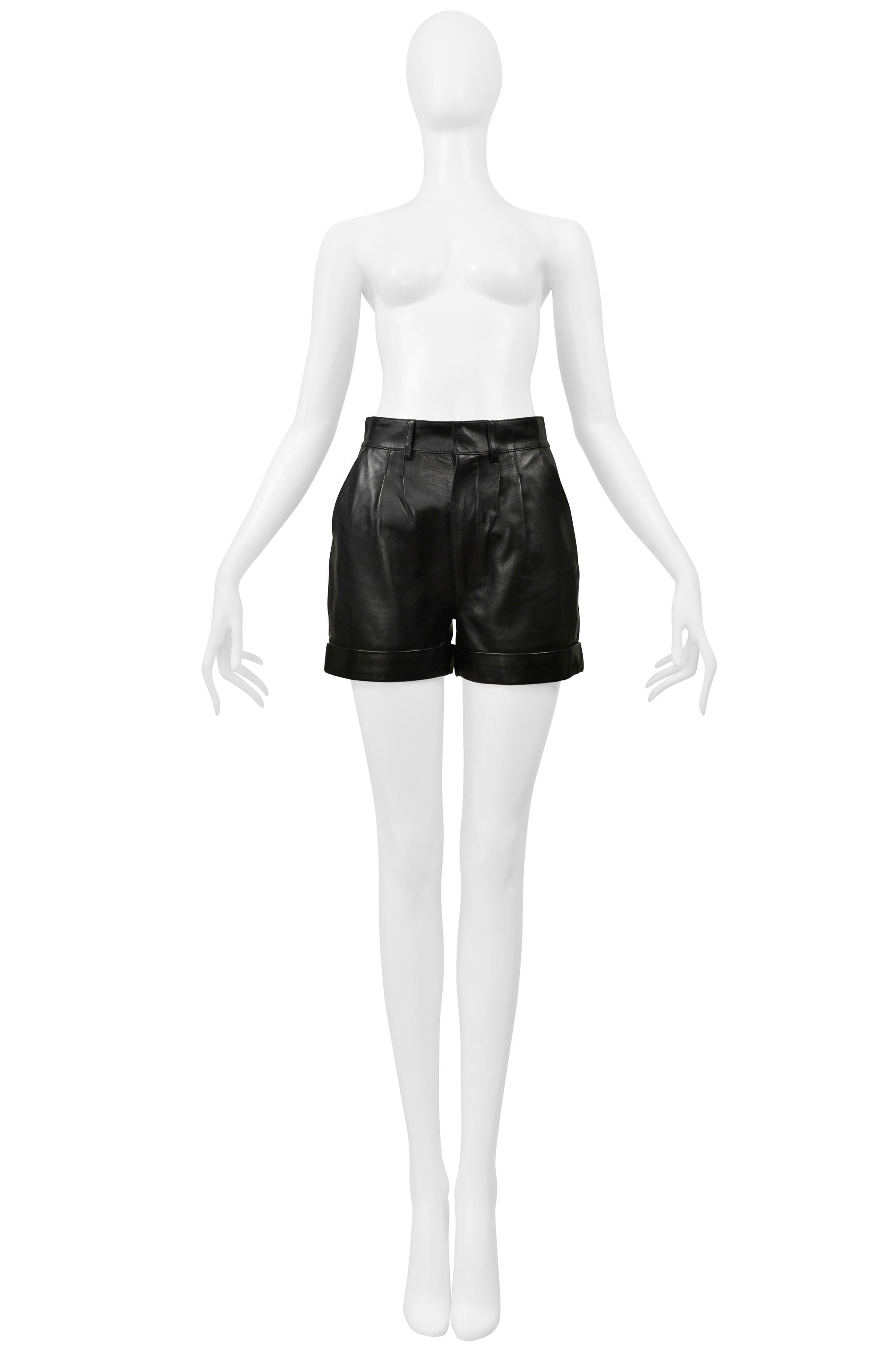 Resurrection Vintage is thrilled to present a pair of Saint Laurent Paris by Hedi Slimane black leather shorts featuring front pleats, side pockets, a flat back with one slit pocket, and a center front side zipper.  

Saint Laurent Paris 
Designed