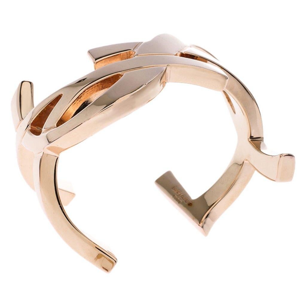 Wear your love for the brand with this Cassandre bracelet from the house of Saint Laurent Paris. It is crafted in gold-plated metal and the curve is achieved with the YSL letters. The bracelet has a distinct appeal that you will adore.

Includes: