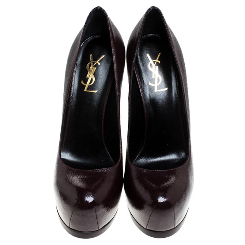 Fashionable and chic, these Tribtoo pumps from Saint Laurent will cut an alluring silhouette from day to night. Crafted from patent leather, the pumps have a dark burgundy shade, concealed platforms, and 15 cm heels.

Includes: The Luxury Closet