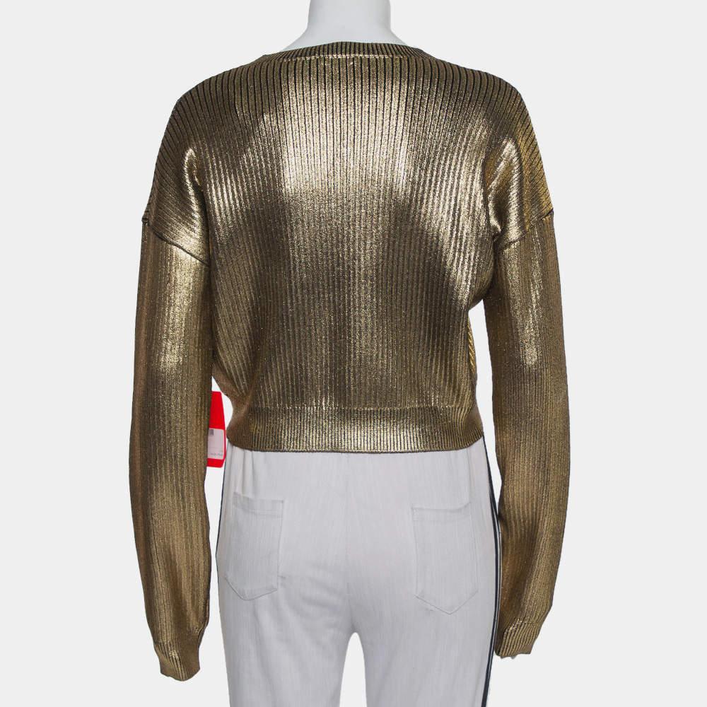 A cropped rib-knit sweater for women by Saint Laurent knit that has an eye-catching design. It comes in gold with dropped shoulders, long sleeves, and a round neckline.


