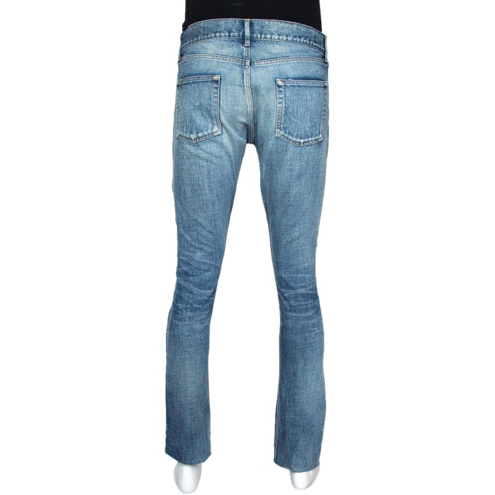 These stylish Saint Laurent Paris jeans are absolute must-haves! Crafted from pure cotton and come in a lovely shade of indigo. They are designed with a washed effect, distressed detailing, zip closure, five pockets, belt loops, and a skinny