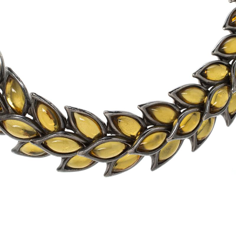 Accessories that are high on style are absolutely worth the buy, such as this choker by Saint Laurent Paris. It has been so well made using silver-plated metal in a collection of leaves, each embedded with yellow Gripoix.

Includes: The Luxury
