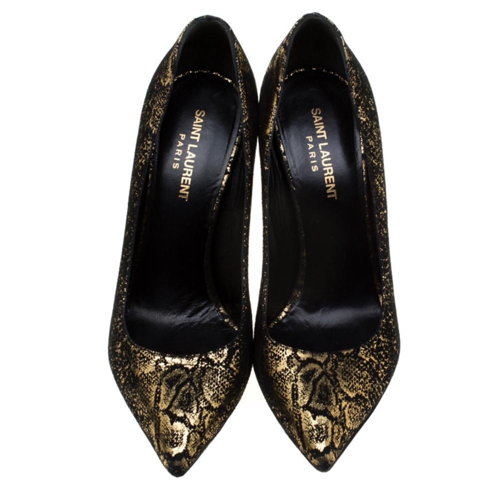 Get set to rock a fashionable outing in these gorgeous pumps from Saint Laurent Paris! These metallic gold and textured black pumps have been crafted from suede and styled with pointed toes. They come equipped with comfortable leather lined insoles