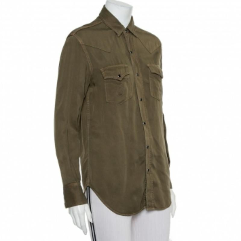 Perfect to pair with a simple pair of jeans or tucked into a smart skirt, Saint Laurent's shirt is an easy-to-stye item. It is designed in military green with a simple collar, long cuffed sleeves, chest pockets, and front button closure.