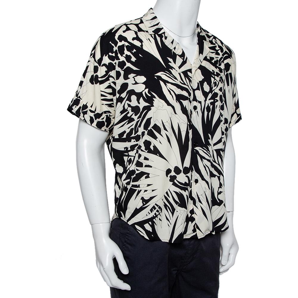 This monochrome bowling shirt from Saint Laurent has a vacation-appropriate design of jungle prints all over. The twill shirt has an open collar, short sleeves, and full front buttons.

