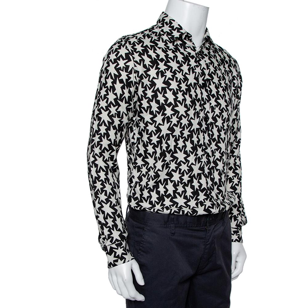 Covered in star prints, Saint Laurent's shirt for men delivers a comfortable and fashionable style. It features a simple collar, long sleeves with buttoned cuffs, and full front button closure.

