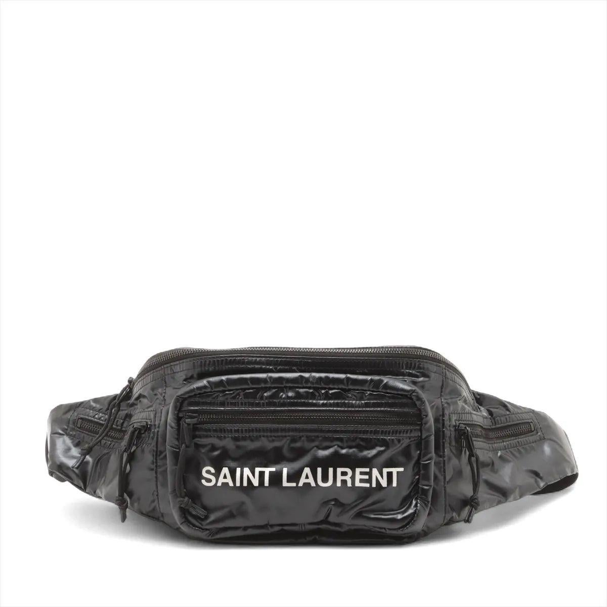 The Saint Laurent Paris Nuxx Sling Bumbag in Black is a sleek and versatile piece that blends urban functionality with refined luxury. Crafted from durable nylon with smooth leather accents, the minimalist design features the Saint Laurent logo