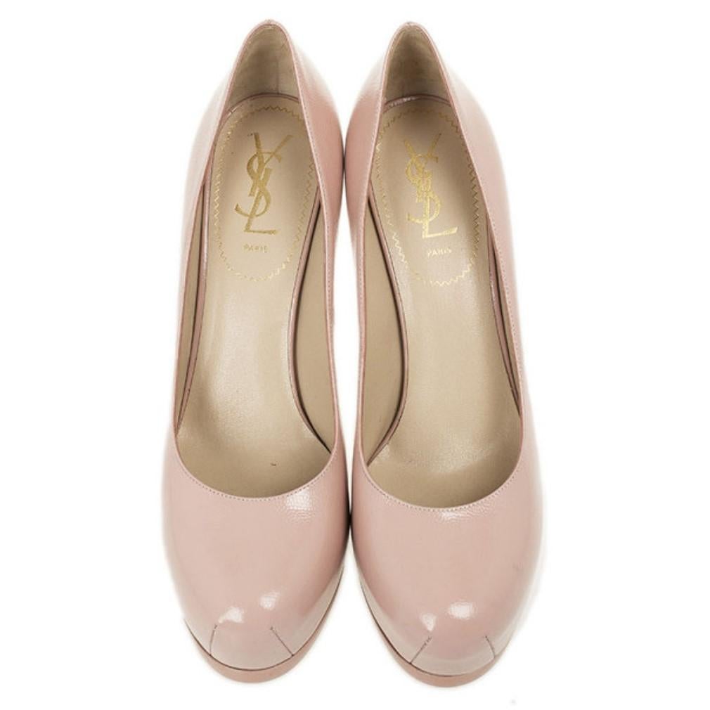 These Pink Tribtoo Pumps by YSL depict true class. Crafted from leather in a gorgeous shade of pink, these rounded toe pumps stand 11cm tall on the Tribute’s signature square heels. The padded insoles are lined with leather and feature YSL labels.

