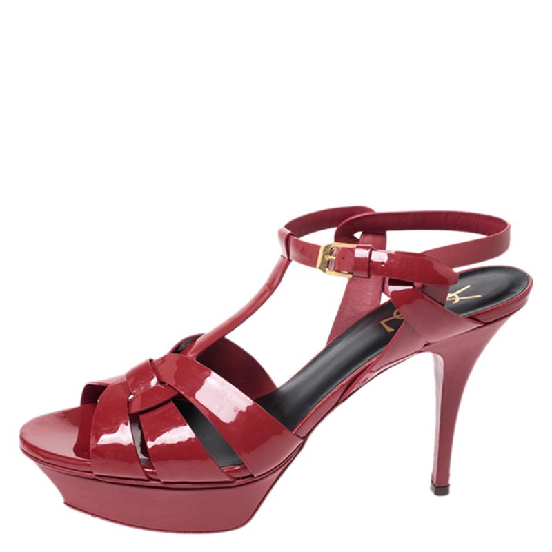 One of the most sought-after designs from Saint Laurent is their Tribute sandals. They are such a craze amongst fashionistas around the world, and it is time you own one yourself. These red ones are designed with leather straps, ankle fastenings and