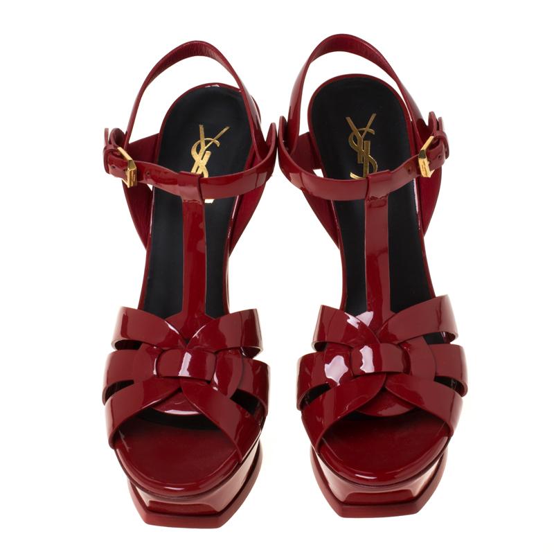 One of the most sought-after designs from Saint Laurent is their Tribute sandals. They are such a craze amongst fashionistas around the world, and it is time you own one yourself. These red ones are designed with patent leather straps, ankle