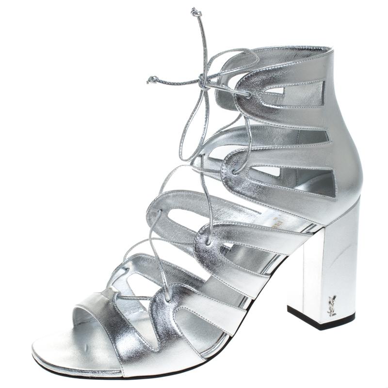 These sandals from Saint Laurent Paris will lend a stylish and playful edge to your feet. Look glamorous no matter what you wear, with these beautiful sandals. Crafted in Italy, they are made from quality leather and come in a lovely hue of silver.