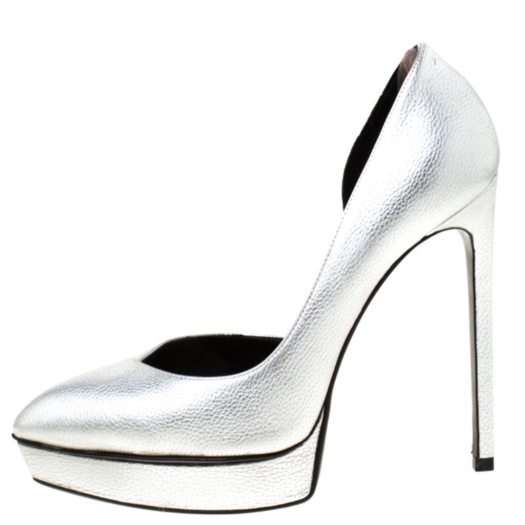Create a sophisticated look with this pair of leather pumps from Saint Laurent Paris. The pumps feature a d'orsay cut, pointed toes, and 13.5 cm heels. Add a metallic silver touch to your style by donning this pair of pumps.

Includes: Original
