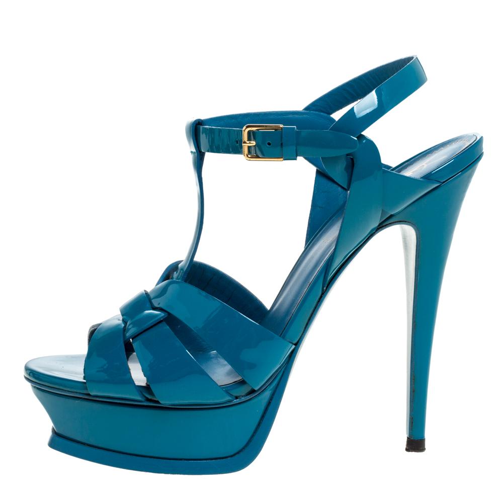 One of the most sought-after designs from Saint Laurent is their Tribute sandals. They are such a craze amongst fashionistas around the world, and it is time you own one yourself. These teal ones are designed with patent leather straps, ankle