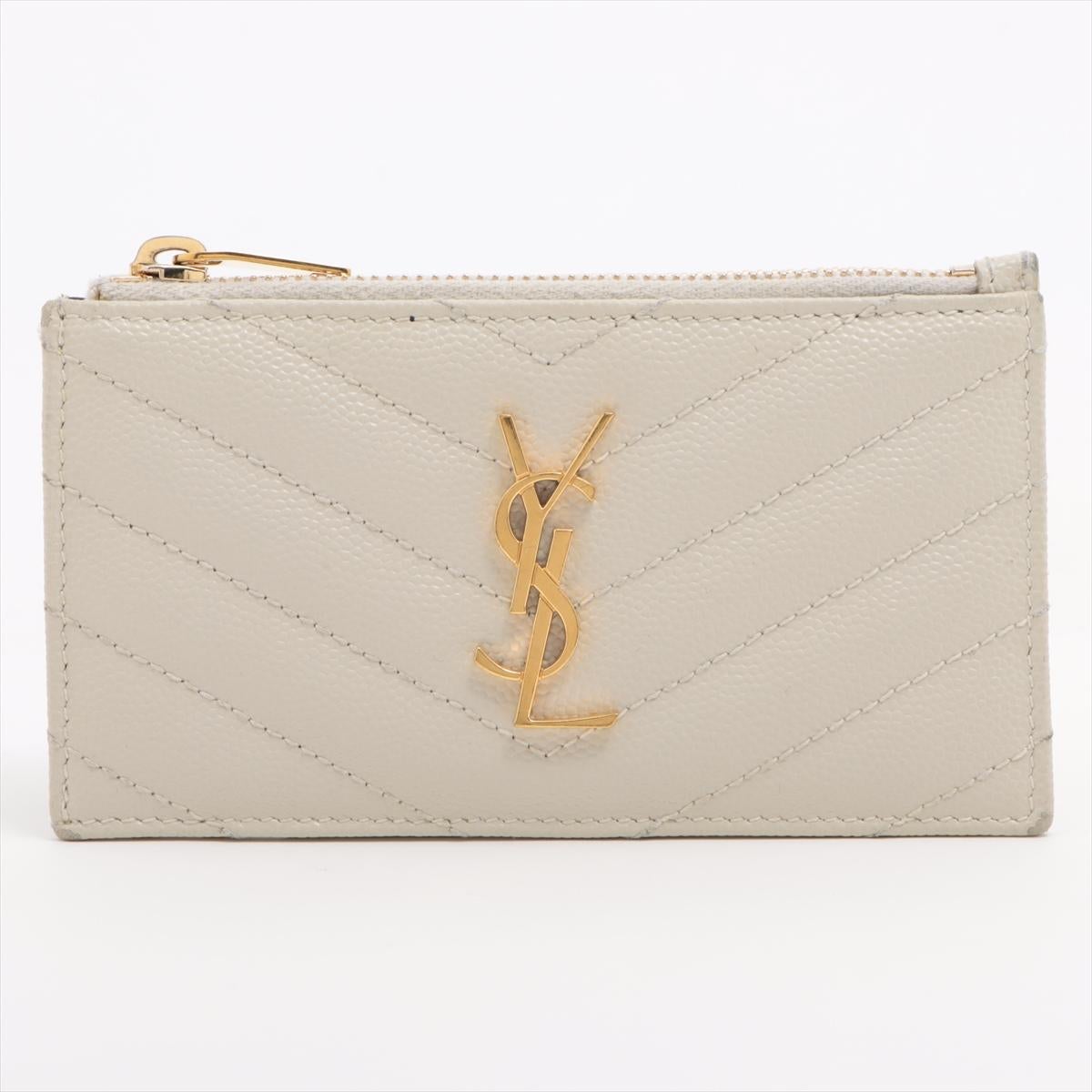 The Saint Laurent Paris V Stitch Leather Coin Card Case in White is a stylish and practical accessory that combines elegance with functionality. Crafted from high-quality leather, the coin card case showcases Saint Laurent's signature craftsmanship