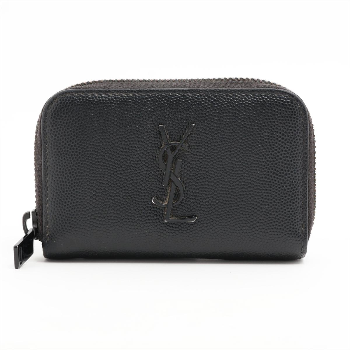 The Saint Laurent Paris YSL Leather Coin Case in Black is a sleek and sophisticated accessory that effortlessly combines luxury and practicality. Crafted with meticulous attention to detail, the case features smooth black leather, exemplifying