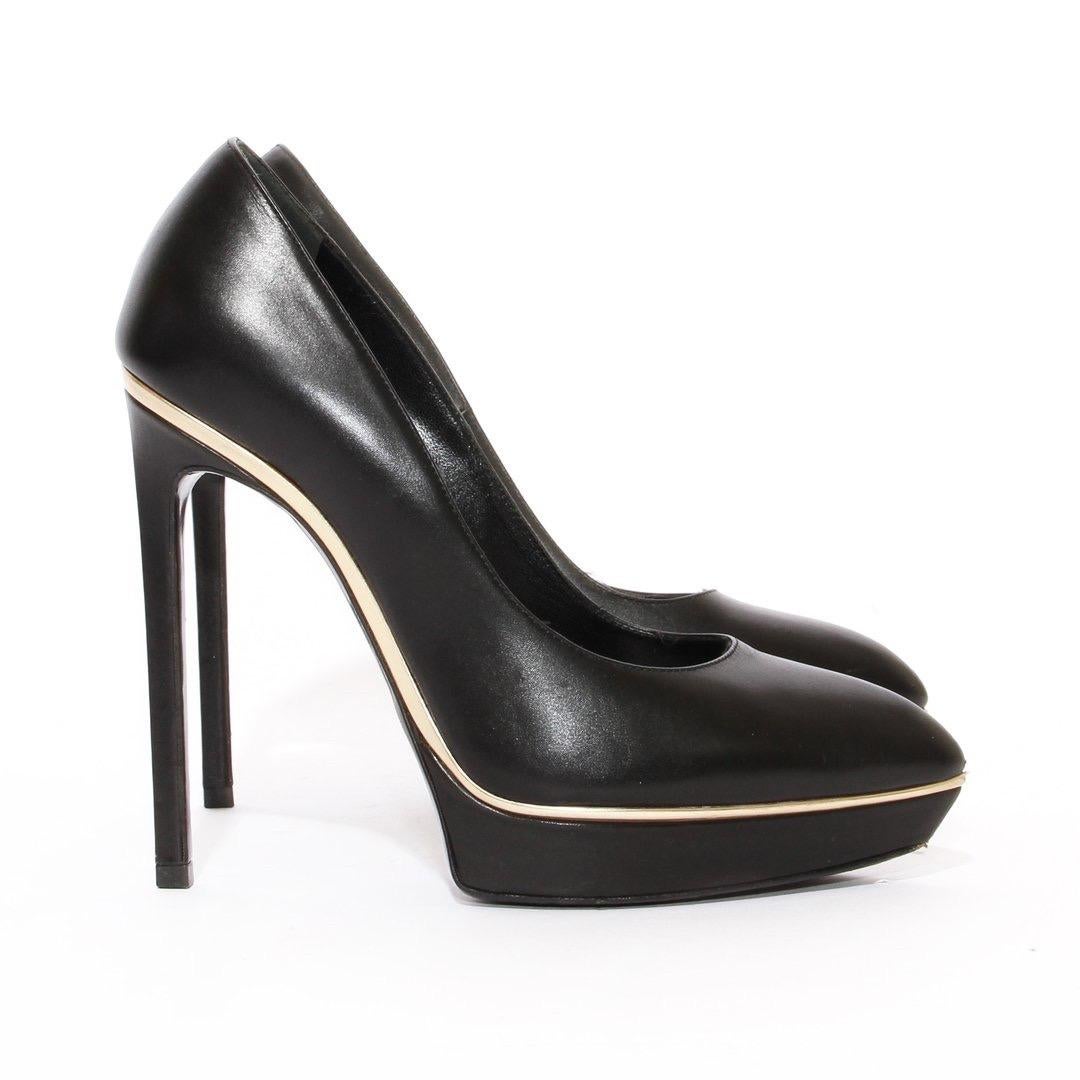 Platform heel by Saint Laurent 
Black leather
Gold-tone trim
Pointed toe
Leather insole
Made in Italy
Condition: Good, scuffing on the sole. Adhesive sticker mark. Consistent with use and wear. (see photos) 

Size/Measurements:
Size 37
5