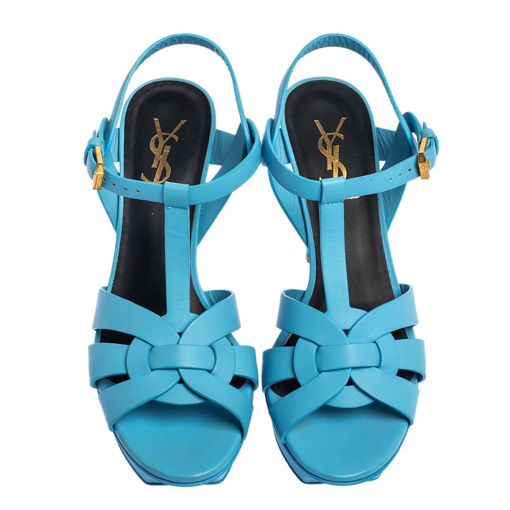 One of the most sought-after designs from Saint Laurent is their Tribute sandals. They are such a craze amongst fashionistas around the world, and it is time you own one yourself. These blue ones are designed with leather straps, ankle fastenings,