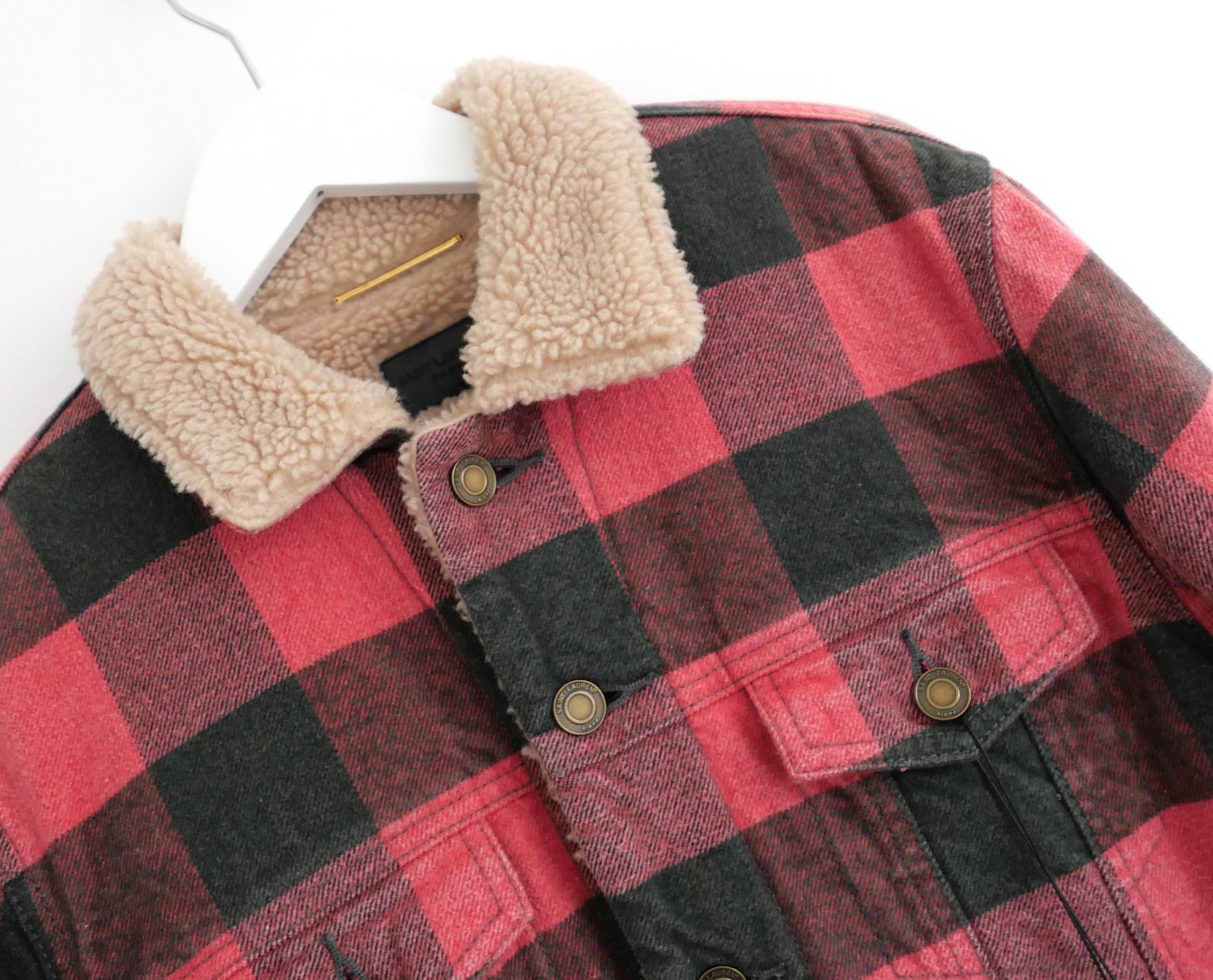Fab Saint Laurent plaid jacket from the Pre-Fall 2020 collection. Bought for £2250 and new with tag. 

Made from soft, vintage washed black and red plaid cotton flannel with a fluffy faux shearling inner. It has embossed antiqued brass rivet