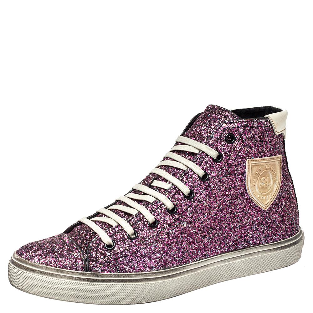These Saint Laurent high-top sneakers are especially fashioned for people with a love for shimmer. They are covered in glitter, secured with lace-ups, and lined with canvas. Durable rubber soles make the sneakers ready.

Includes: Original Box,