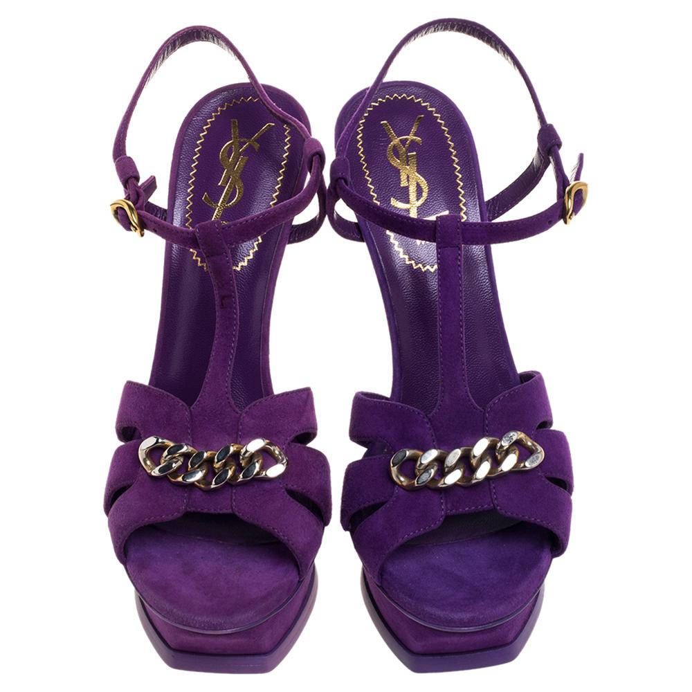 Leave your audience spellbound with this pair of Saint Laurent sandals. These beautiful Tribute sandals have been styled with perfection just so a diva like you can flaunt them. Royal in purple, they have been crafted from suede and designed with