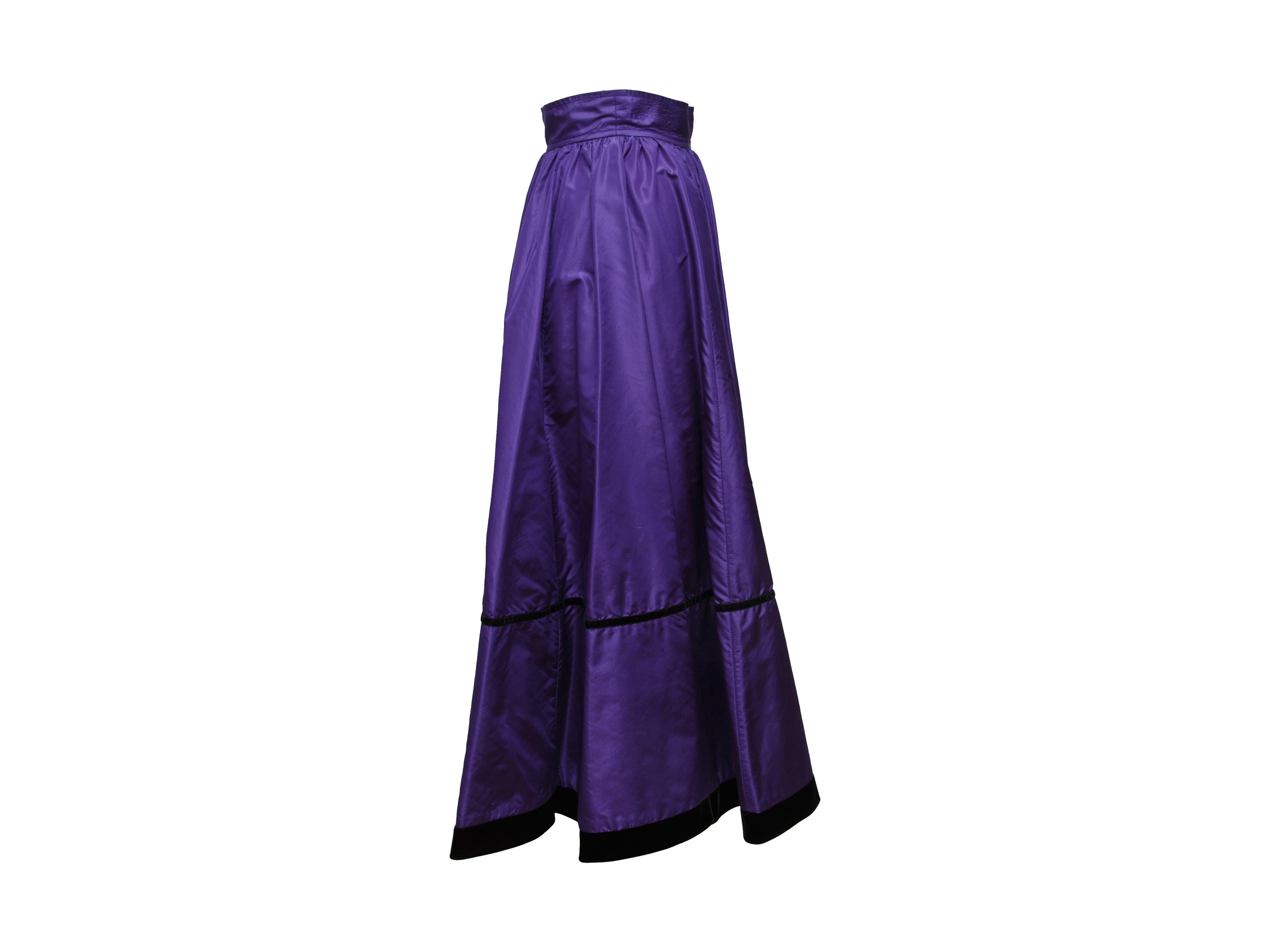 Product details: Vintage purple midi skirt by Saint Laurent. Black velvet trim throughout. Bow accent at back. Designer size 34. 24
