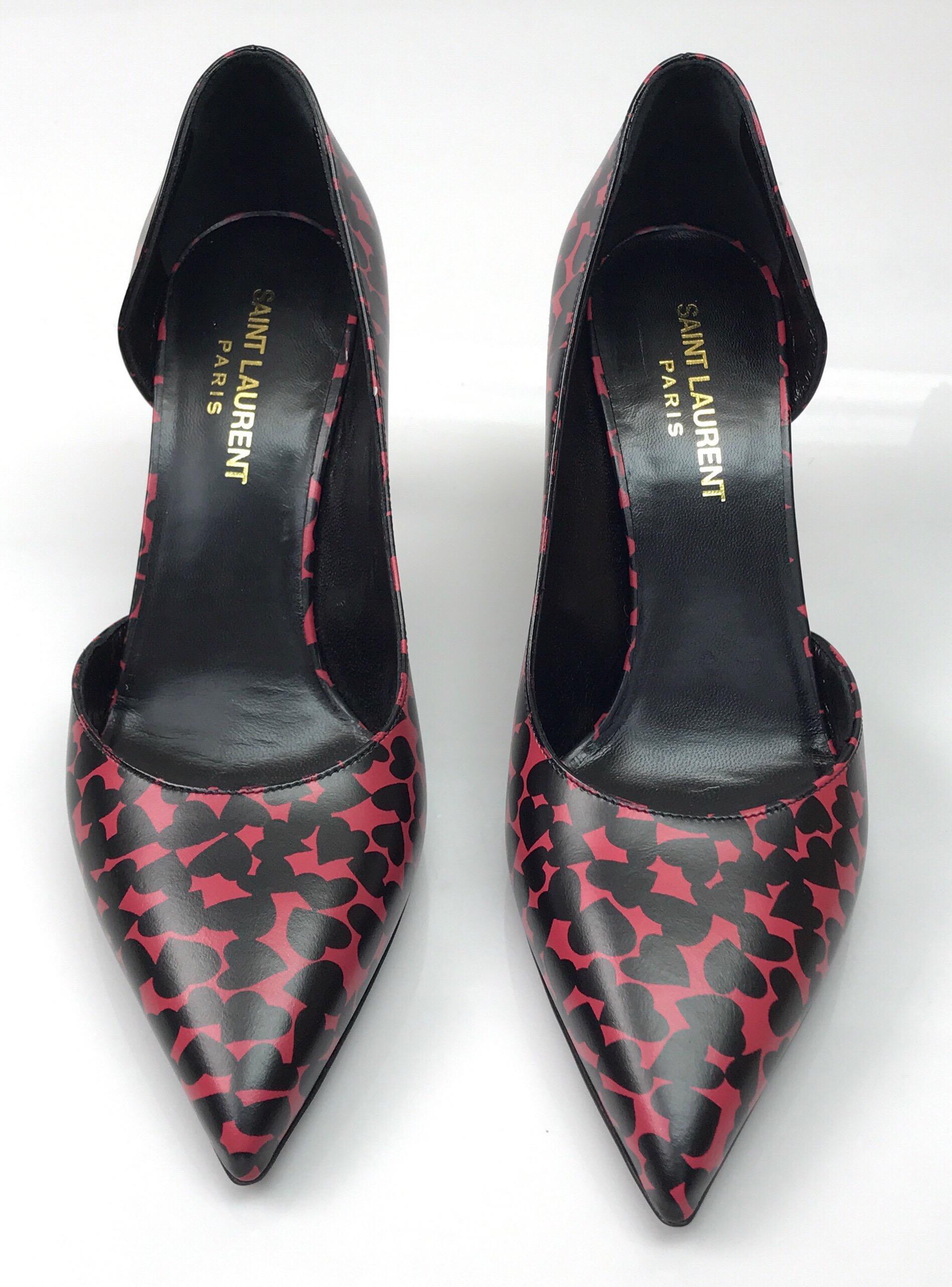 Saint Laurent Red & Black Heart Pumps-36.5. These adorable Saint Laurent Paris heels are in excellent condition. They are new and never previously worn. The heels are a closed pointed toe and made of leather. They are red with black hearts