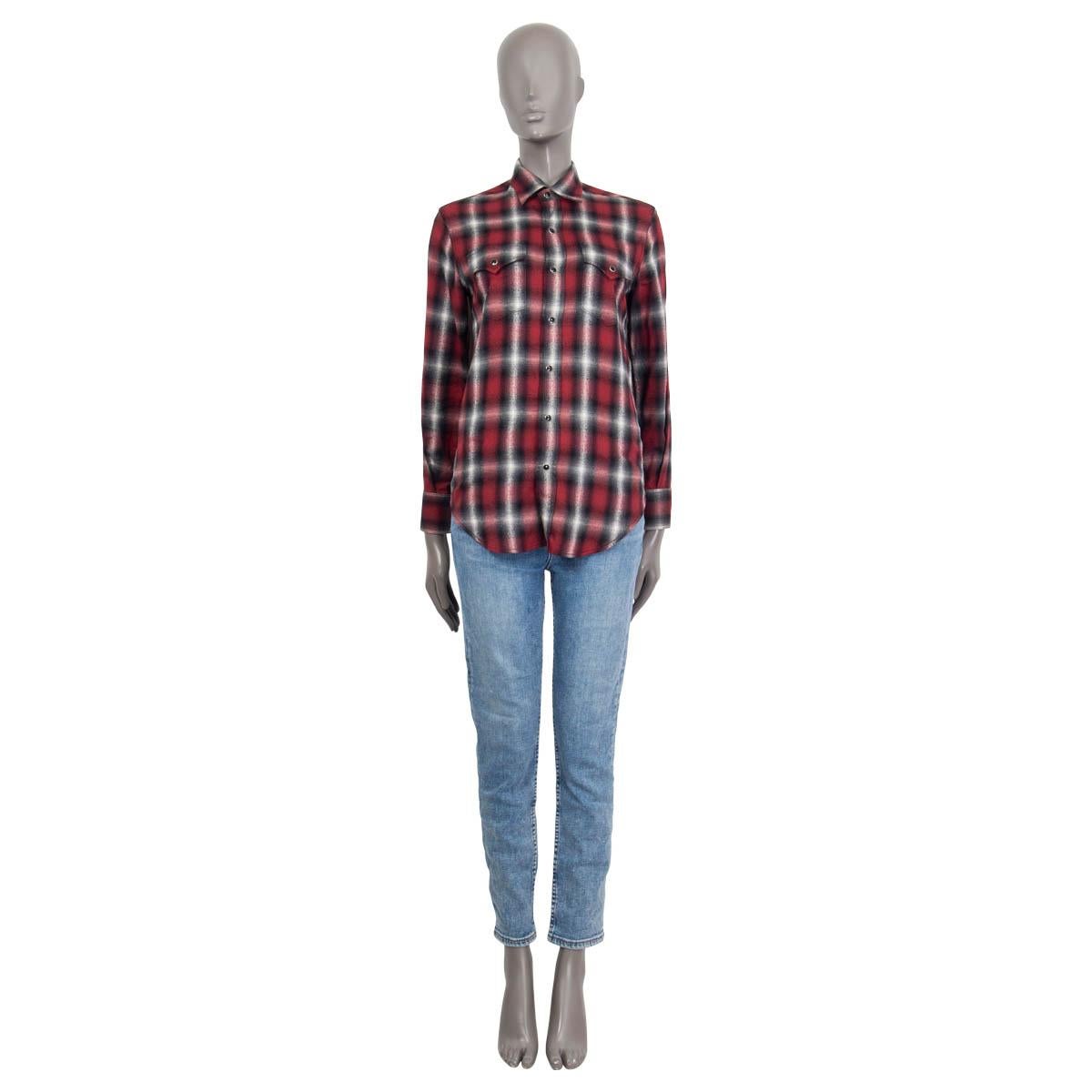 100% authentic Saint Laurent long sleeve flannel shirt in red, gray, white and black cotton (58%) and lyocell (42%). Features two buttoned flap pockets at the chest and buttoned cuffs. Opens with seven push buttons on the front. Unlined. Has been