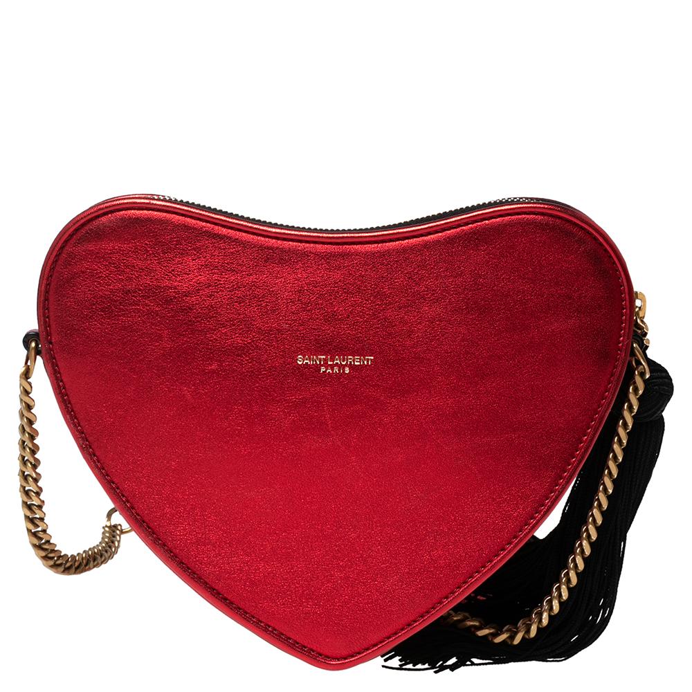 This eye-catching, beautiful red bag deserves to be in your closet. It is crafted from leather into a cute heart shape and features a tassel detail, a slender shoulder strap, and a sleek silhouette making it easy to be worn as a crossbody too. It