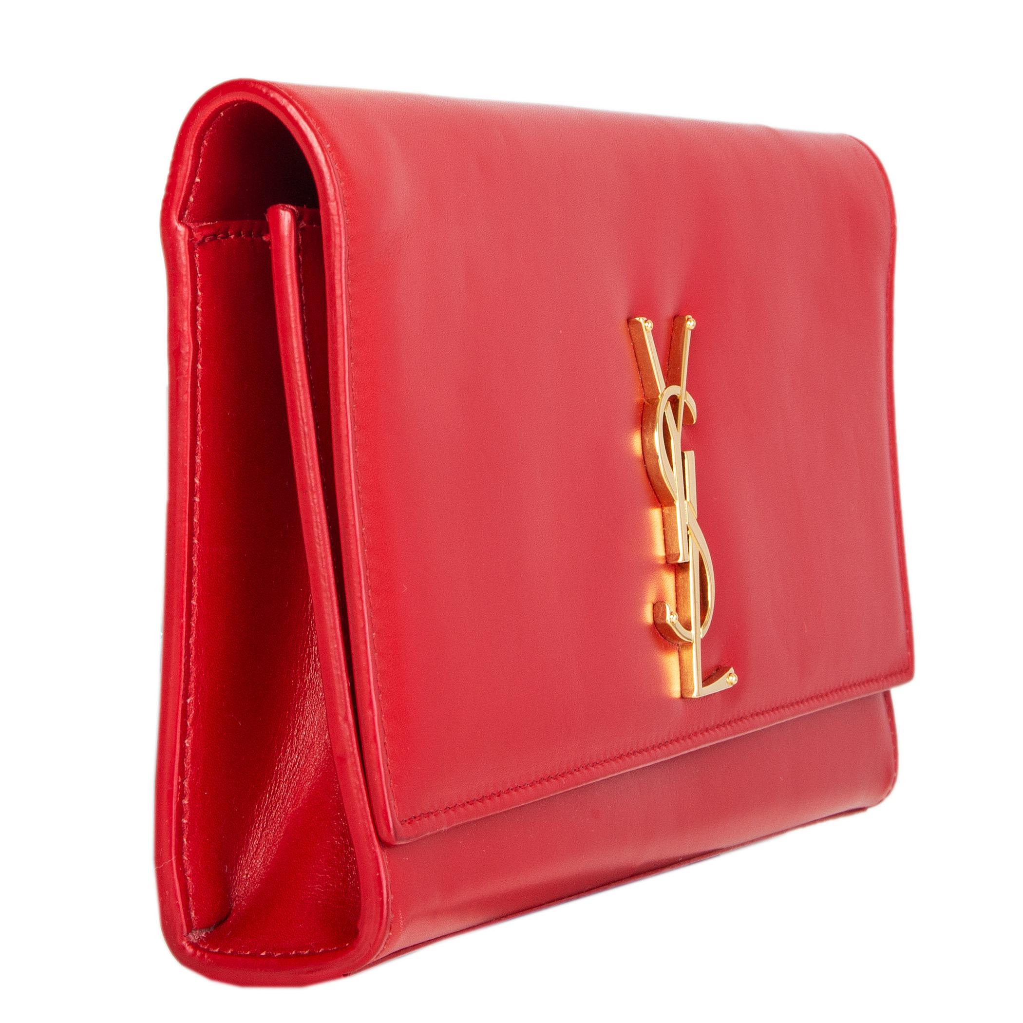 Saint Laurent 'Kate' flap clutch in red nappa leather with gold-tone YSL lettering and a linear silhouette. Opens with a magnetic button under the flap and is lined in red suede with one open pocket against the back. Has been carried and is in